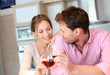 Happy couple cheering with glass of wine Happy couple cheering with glass of wine
