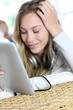 Young modern girl using electronic tablet