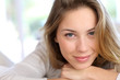 Beautiful young woman with blue eyes
