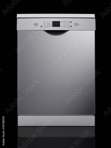 Photo: Metallic dishwasher on black background Metallic dishwasher on black background