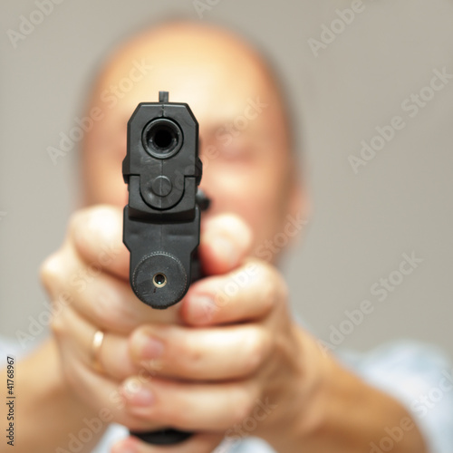 Photo: Man with a gun Man with a gun