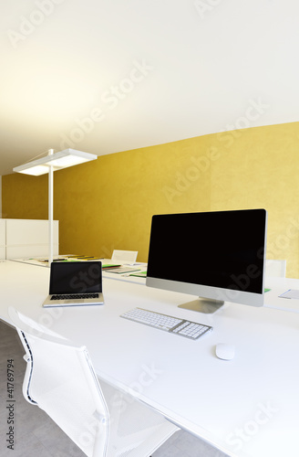 Photo: modern office interior design, workplace with computers modern office interior design, workplace with computers