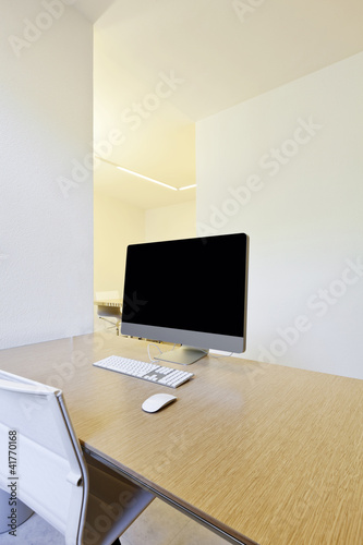 Photo: modern office interior design, workplace with computers modern office interior design, workplace with computers