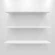 Empty white shelves on light grey background