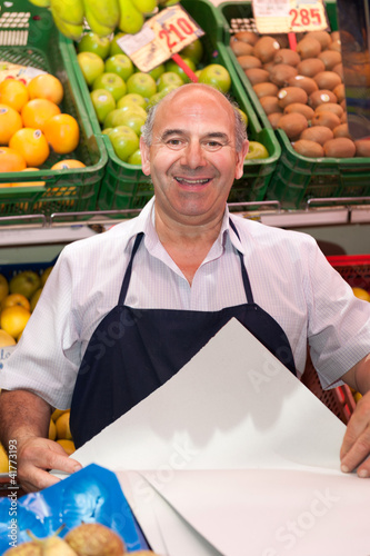Photo: Smiling greengrocer Smiling greengrocer