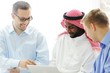 Multicultural different ethnic group working on laptop together