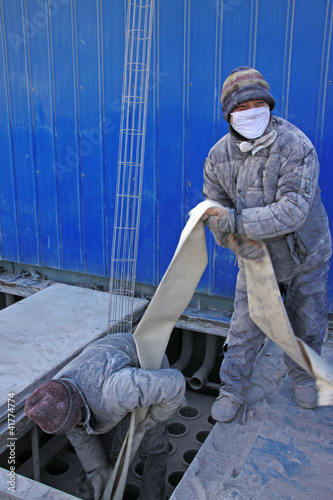 Photo: workers in the industrial enterprise construction workers in the industrial enterprise construction