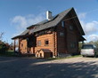 wooden log homestead house and solar collectors on roof wooden log homestead house and solar collectors on roof