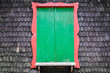 Green window on wooden textrued wall