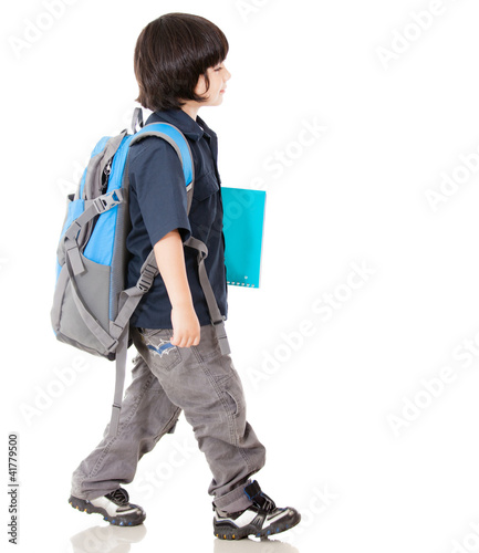 Photo: Boy walking to school Boy walking to school