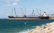 A bulk carrier ship loading cargo at port A bulk carrier ship loading cargo at port