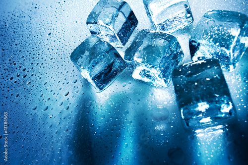 Photo: Ice cubes over wet backgrounds with back light Ice cubes over wet backgrounds with back light