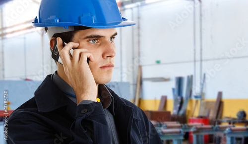 Photo: Engineer talking on the phone Engineer talking on the phone