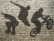 ombres de Skate, Roller & BMX sur mur de briques