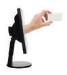 Computer screen and hand with card