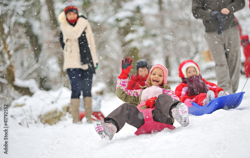 Photo: Little girl on sleigh Little girl on sleigh