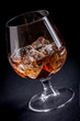 Whiskey / Cognac on black background Whiskey / Cognac on black background