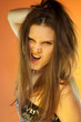 Emotional woman on orange background