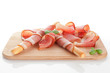 Prosciutto with bread on cutting board. Prosciutto with bread on cutting board.