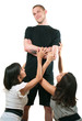 man and two young women