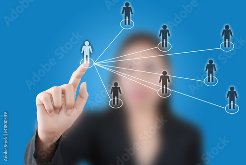 Photo: Business lady pushing people Social Network. Business lady pushing people Social Network.
