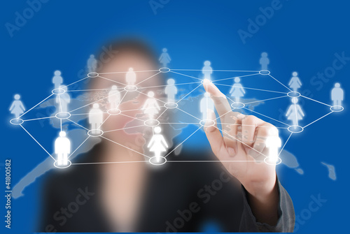 Photo: Business lady pushing people Social Network. Business lady pushing people Social Network.