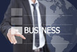 Businessman pushing Business word on a touch screen interface. Businessman pushing Business word on a touch screen interface.