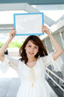 Beautiful young woman with message board. Portrait of asian. Beautiful young woman with message board. Portrait of asian.