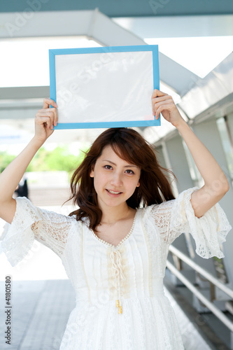 Photo: Beautiful young woman with message board. Portrait of asian. Beautiful young woman with message board. Portrait of asian.