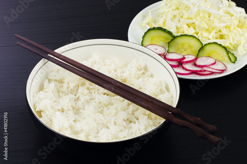 Photo: Steamed white rice with a side salad. Steamed white rice with a side salad.
