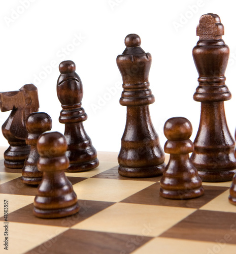 Photo: chess figures and board isolated on white chess figures and board isolated on white