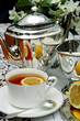 breakfast with a silver teapot and a jasmine bouquet
