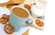 cup of coffee with milk and cookies on table cup of coffee with milk and cookies on table
