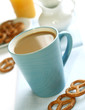 cup of coffee with milk and cookies on table cup of coffee with milk and cookies on table