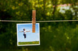 photograph of jumping happy girl with clothespeg