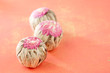 floral blooming  tea balls on pink backdrop