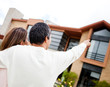 Couple pointing at their dream home
