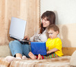 Happy mother and child with laptops Happy mother and child with laptops