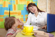 Mother and child eating breakfast