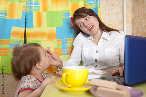 Photo: Mother and child eating breakfast Mother and child eating breakfast
