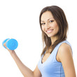 Young woman exercising with dumbbell, isolated Young woman exercising with dumbbell, isolated