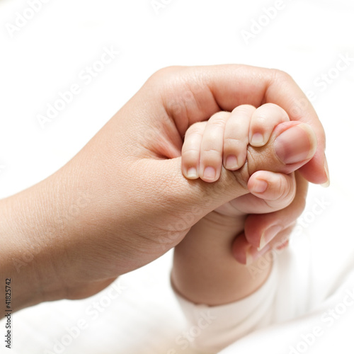 Photo: baby holding mother hand baby holding mother hand