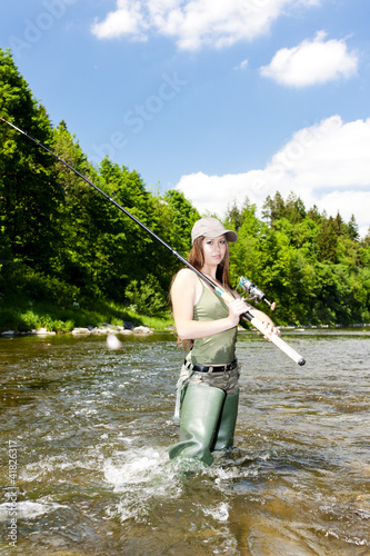 Photo: woman fishing in river, Czech Republic woman fishing in river, Czech Republic