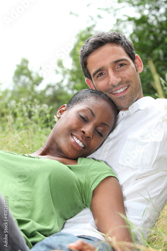 Photo: African woman and white man hugging African woman and white man hugging