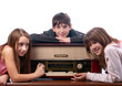 Three teenage friends listening to music on the old radio