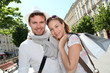 Smiling couple doing shopping in Bordeaux