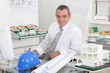 Architect sat working at desk