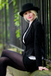 Cute blonde business woman in bowler hat Cute blonde business woman in bowler hat