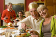 Family having Christmas dinner, portrait of senior couple