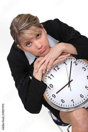 Foto: Businesswoman with a clock Businesswoman with a clock